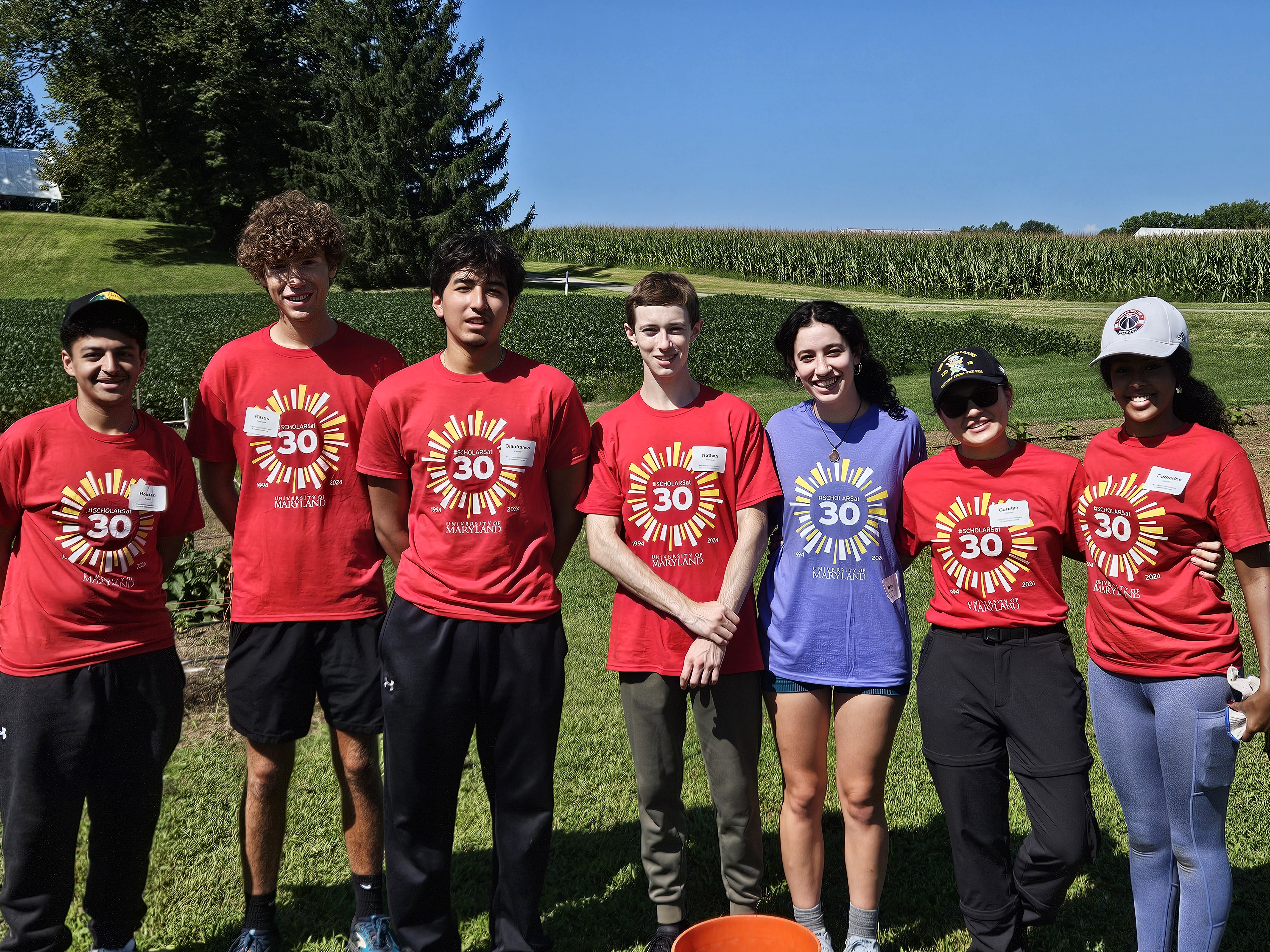 students smiling in a field