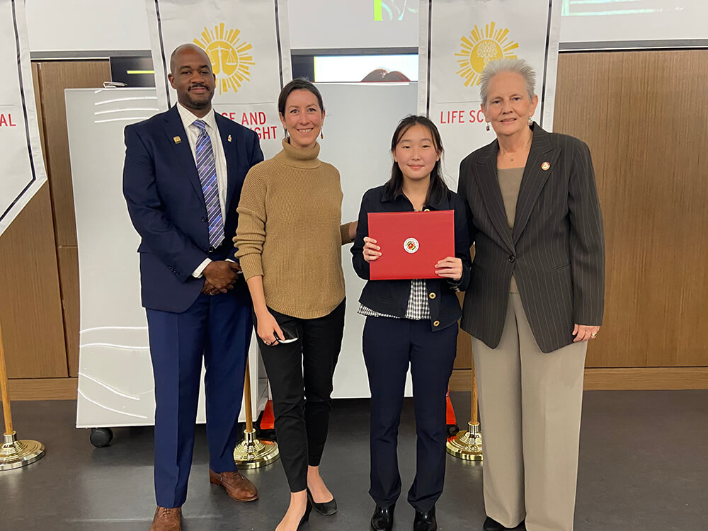 Amy Yim posing with her award