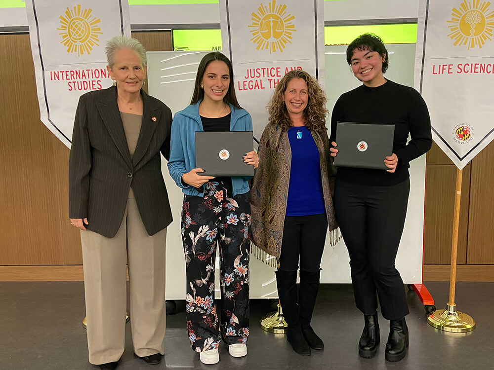 Sarita Miller and Meghan Burke posing with their scholarship awards