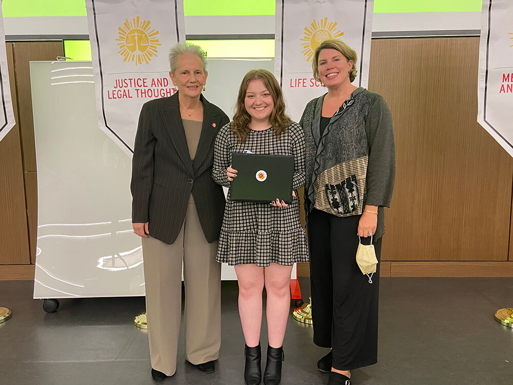 Jordan Homan posing with her scholarship award