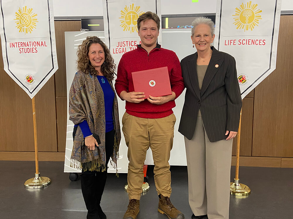 Matthew Fairchild posing with his award