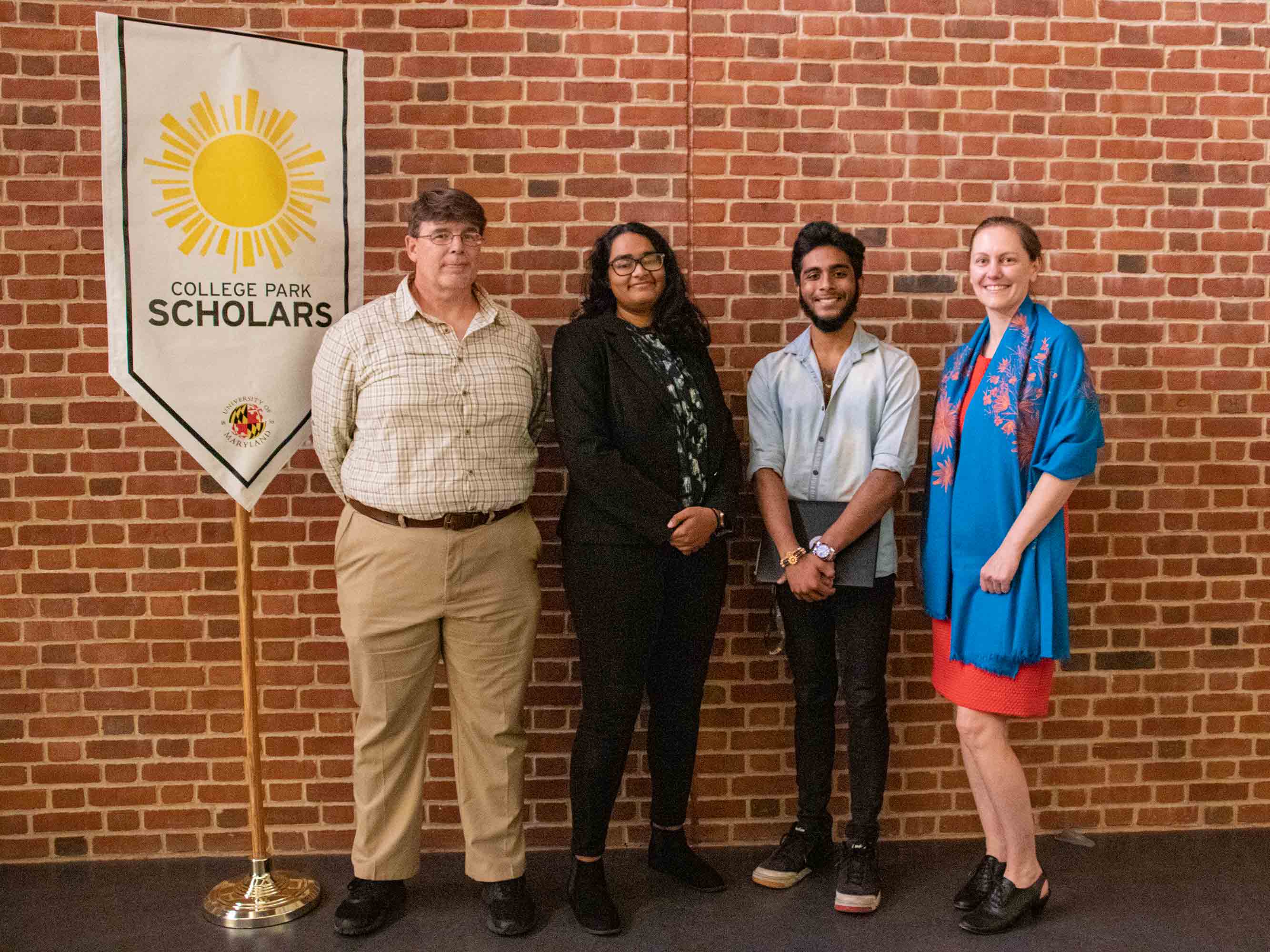 STS Director David Tomblin (l–r), Sona Chudamani, Amol Agrawal and Chandra Turpen pose at the 2022 Scholars Citation Awards ceremony