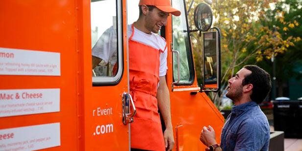 Szeluga and Engle outside food truck