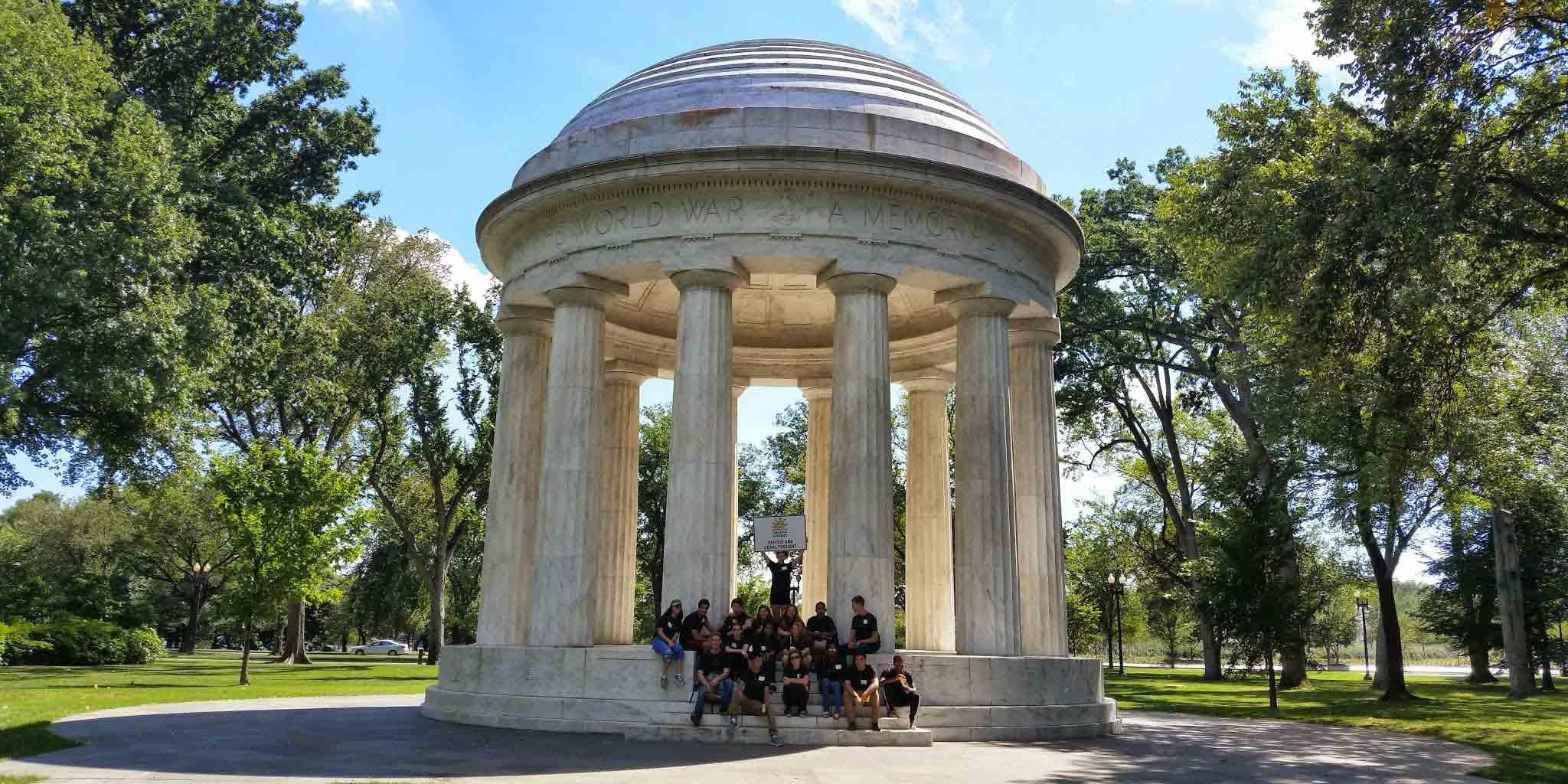 Scholars posing for photo outside