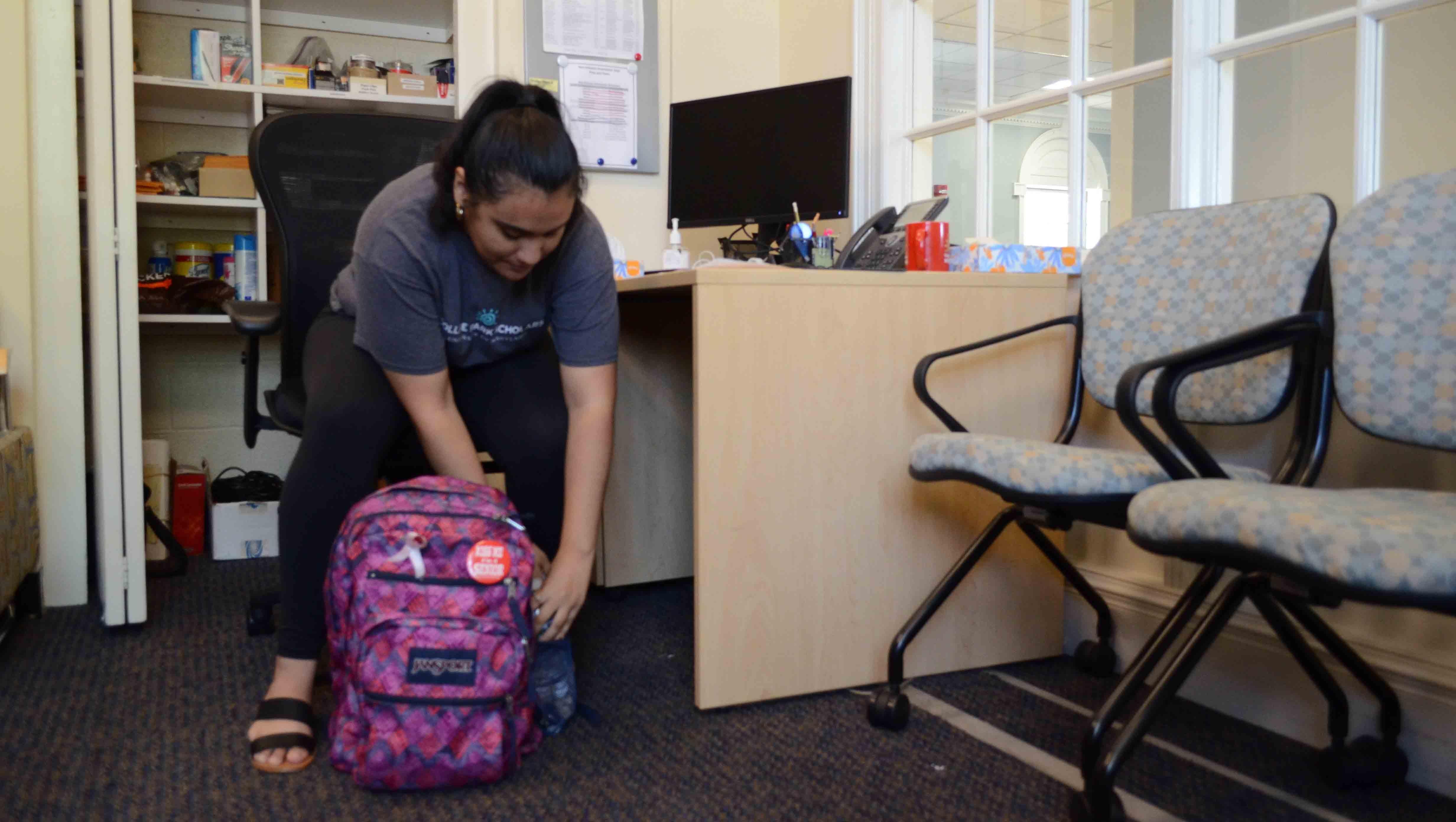 Marlen Cruz packing up her backpack