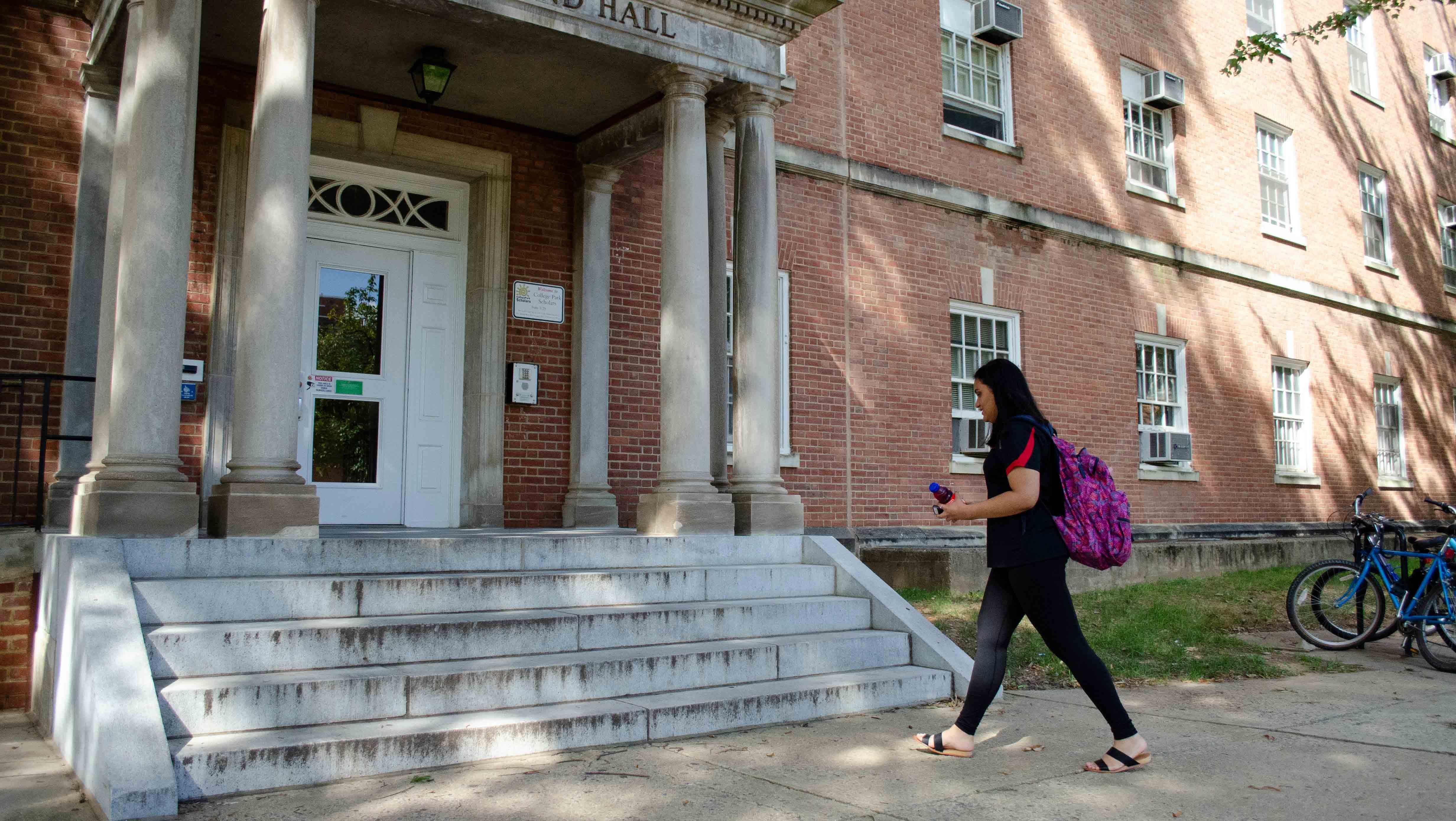 Marlen Cruz walking into Cumberland Hall