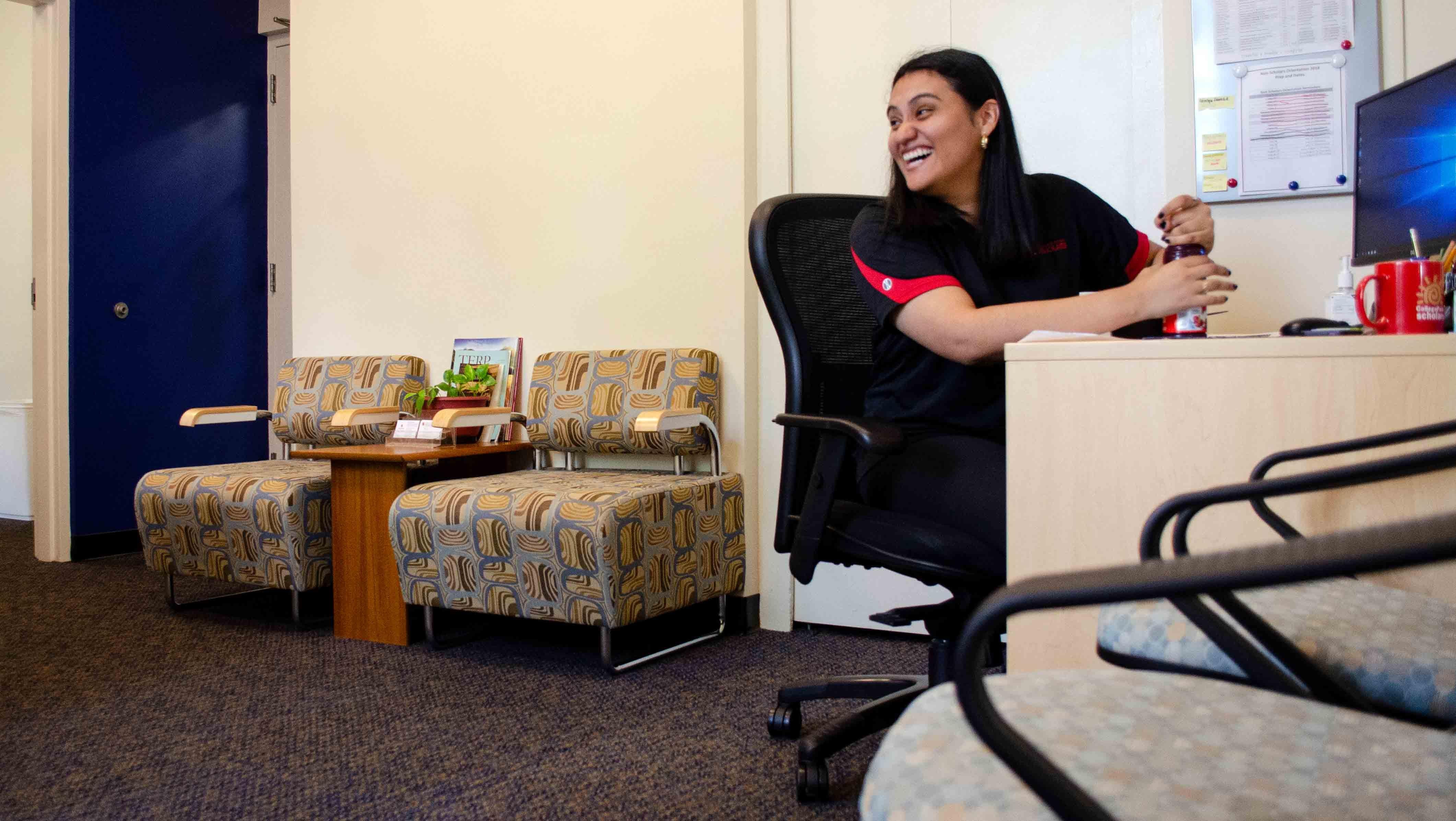 Marlen Cruz working at her desk