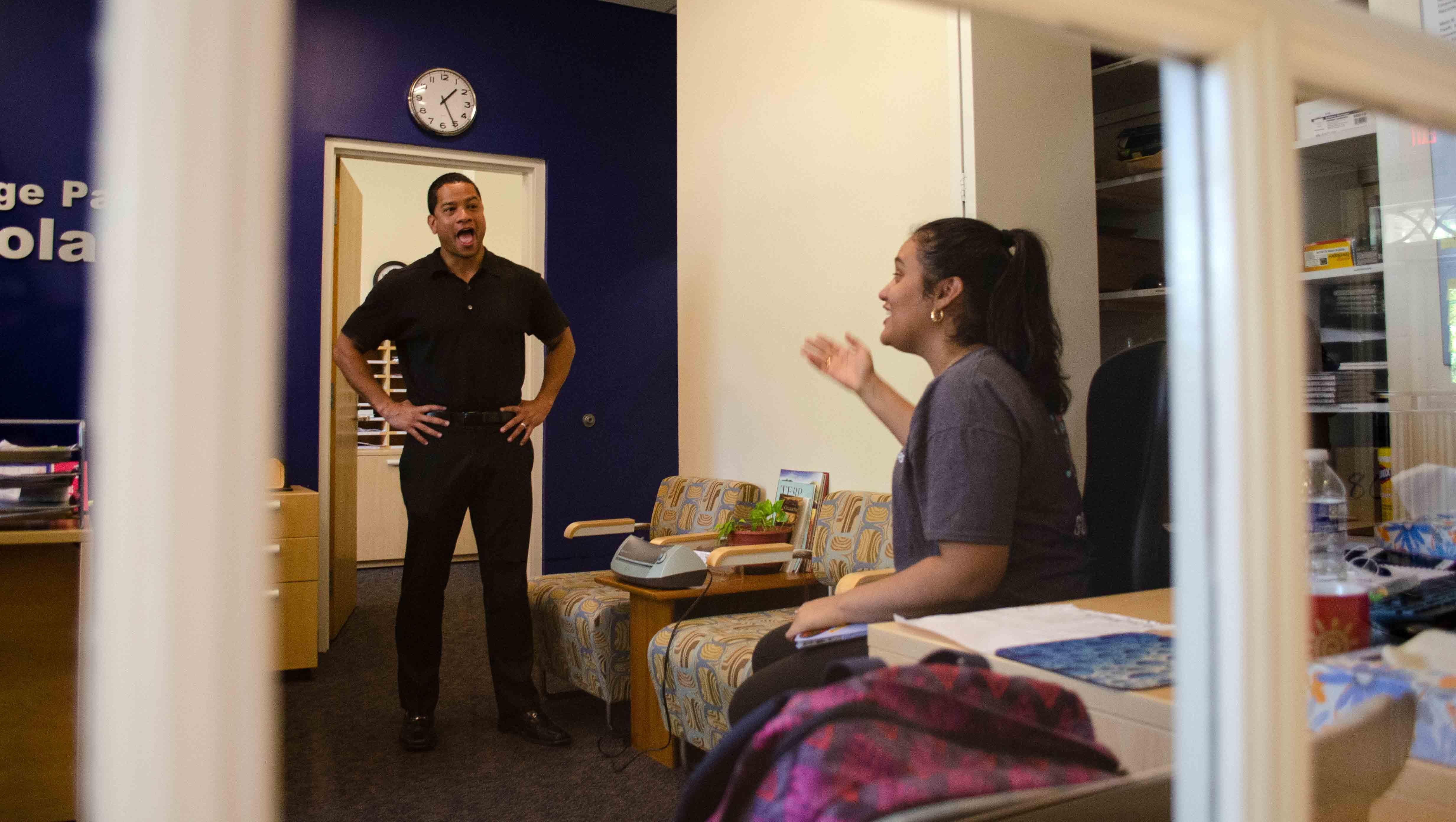 Marlen Cruz talking with Scholars Assistant Director Brent Hernandez