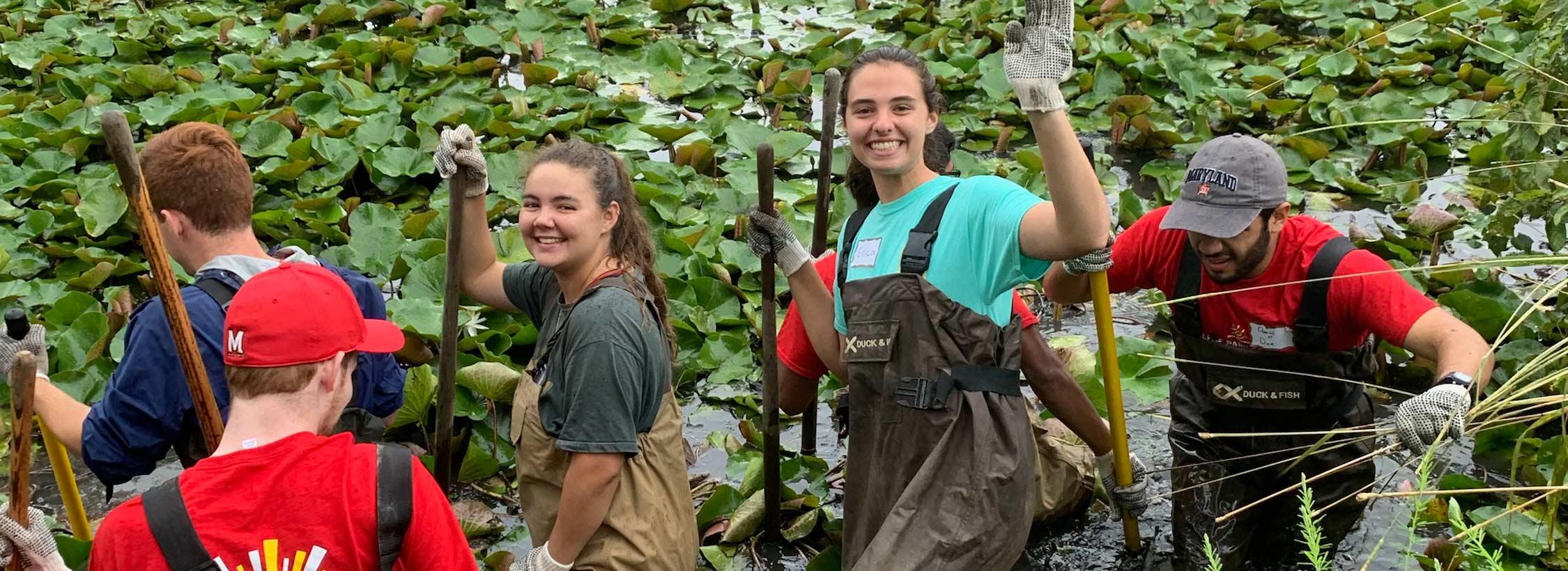 SGC students wave from a bog on Service Day