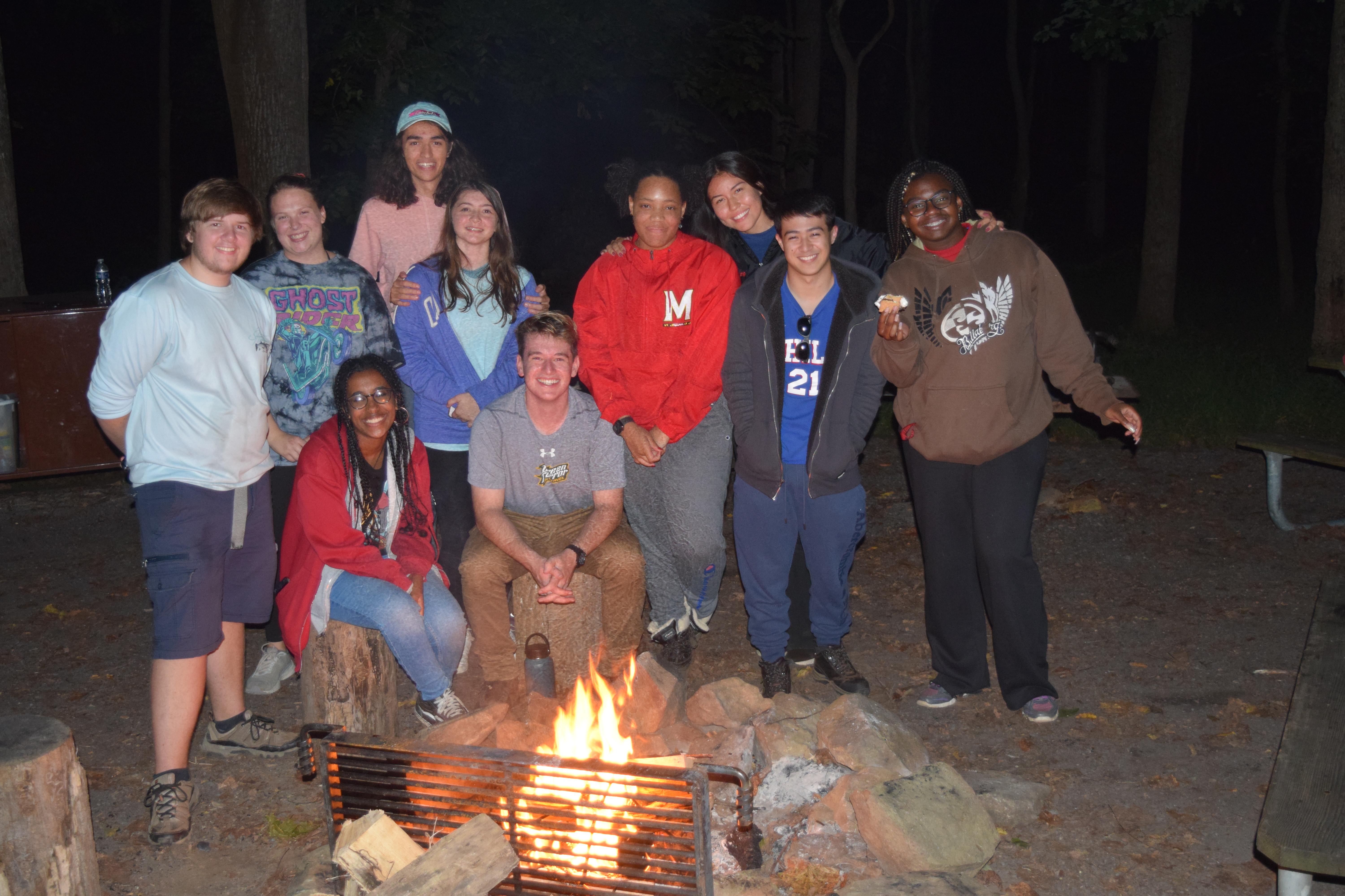 group of students at camp fire